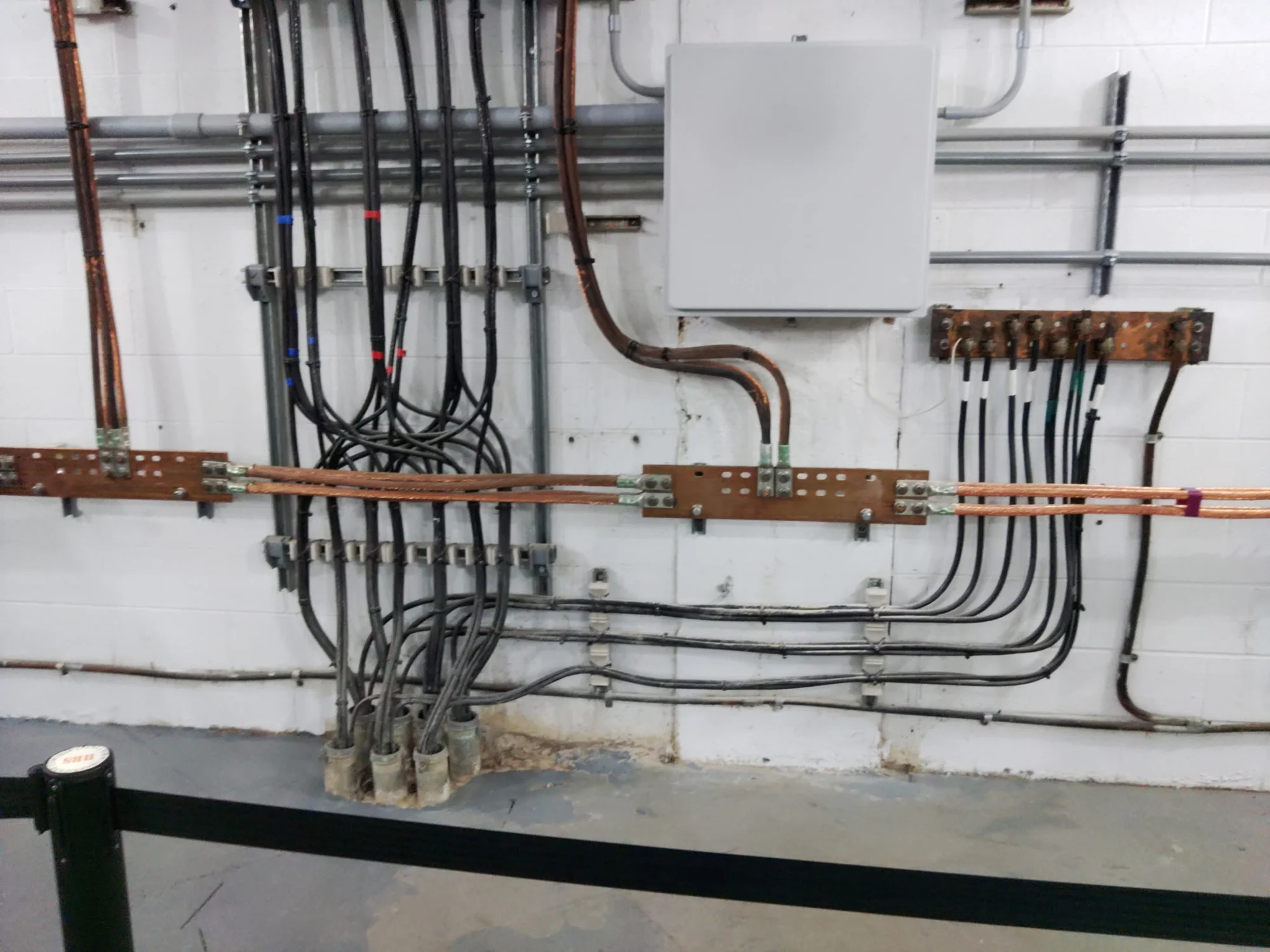 Below-grade installation with coated exposed copper